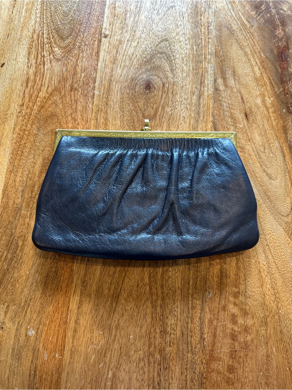 Vintage Nordstrom - genuine navy leather clutch with gold colored hardware.